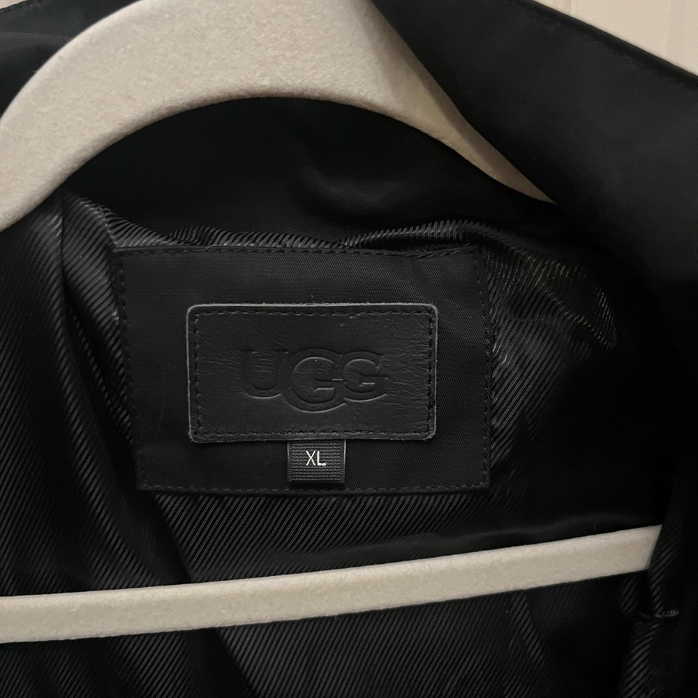 UGG black raincoat, new without tags, never worn